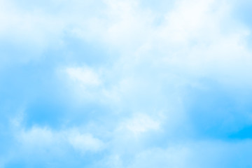clear blue sky with plain white cloud with space for text.