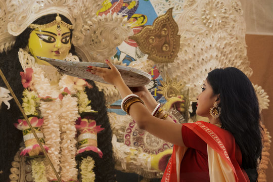 Bengali Married Woman worshipping goddess durga with Bamboo Tray