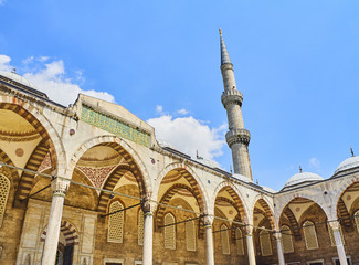 Principal entry to the Arcaded courtyard of The Sultan Ahmet Camii Mosque, also known as The Blue Mosque, with a minaret in the background. Istanbul, Turkey. © Álvaro Germán Vilela
