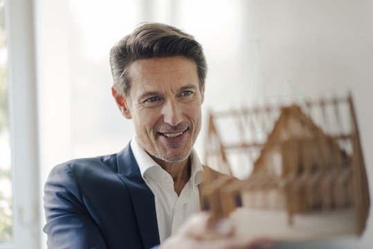 Mature businessman sharing his knowledge with younger colleague