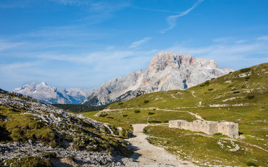 Fototapeta na wymiar panorama with hiking trails and old ruin in foreground in south tyrol