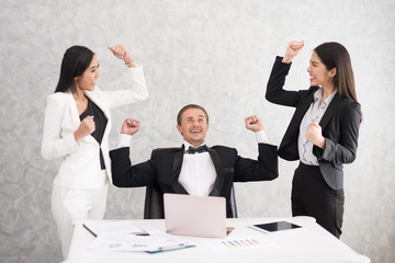 Celebrating success Cheerful young people looking excited. Successful entrepreneurs and business people achieving goals