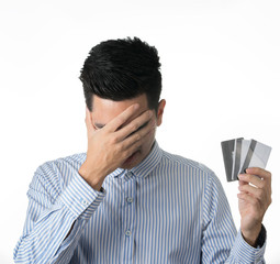 Portrait handsome young asian man wearing a blue shirt holding credit card and stressful isolated on white background. Asian man people.  business success concept.