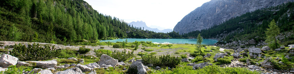 Panoramic shot of the wonderfull Sorapiss lake in the italian Alps, in the Dolomites mountains range close to Cortina in Veneto region, a unique place. The water of the lake is so blue it seems unreal