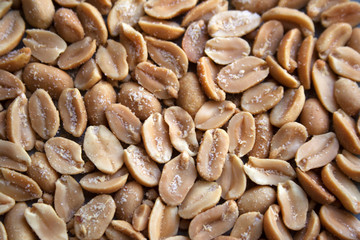 Salted peanut seeds texture close up