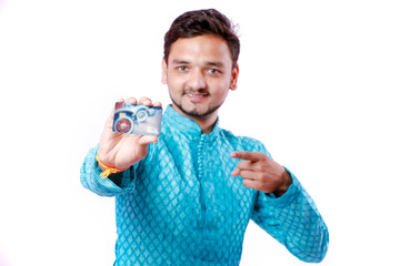 Indian man in ethnic wear and showing card