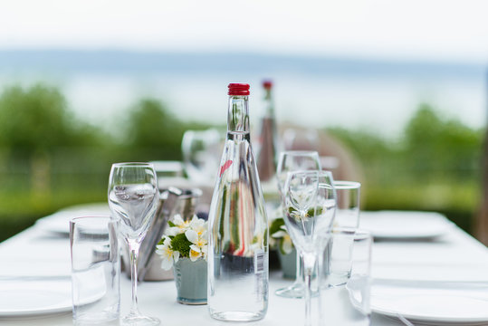 Glass Of Water And Bottle On Table