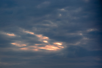 Colorful clouds on dramatic sunset sky