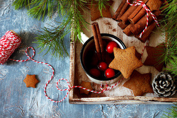 Cinnamon cookie with raspberry tea on christmas background 