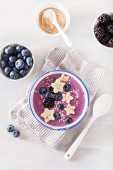 healthy berry smoothie bowl with banana and sesame seed