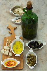 Olive oil tasting and pieces of bread with olives