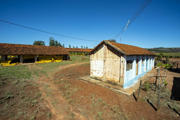  Farm house. Very simple house on a chicken farm. Red earth farm house. Brazil South America.