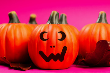 Halloween pumpkin jack o lantern decor with funny faces.