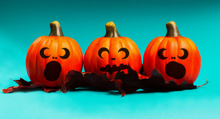 Halloween pumpkin jack o lantern decor with funny faces.