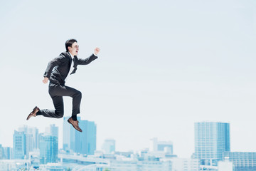 Fototapeta 勢い良くジャンプする男性（ビジネスイメージ） obraz