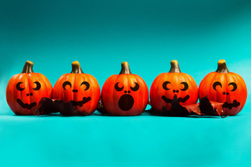 Halloween pumpkin jack o lantern decor with funny faces.