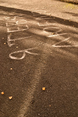 inscription painted i love you on the asphalt in the rays of the sun