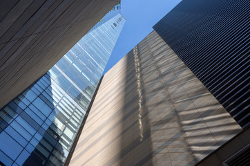 Fototapeta na wymiar Reflection of sunlight on building