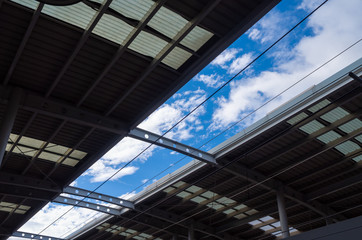 Fototapeta na wymiar Blue crystal clear sky at train station platform