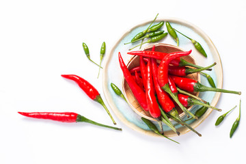 Food concept Chili Padi, Bird's Eye Chili, Thai pepper and red chili on bamboo tray with copy space