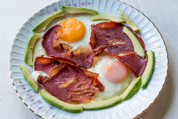Fried Egg with Bacon Pastirma / Pastrami and Avocado Slices for Breakfast.