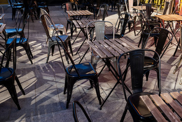 Empty chairs and tables outside a cafe in Southampton, England.