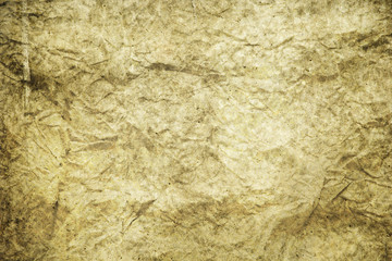 darkness theme. dark background and wallpaper or texture of brown paper old and crumpled have a stain.