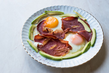 Fried Egg with Bacon Pastirma / Pastrami and Avocado Slices for Breakfast.