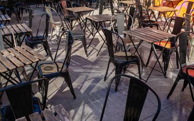 Empty chairs and tables outside a cafe in Southampton, England.