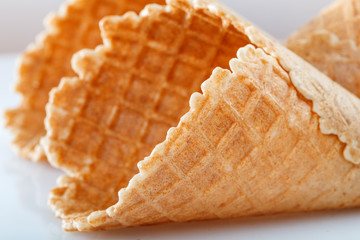 Empty wafer cone cups for ice cream close-up on white background