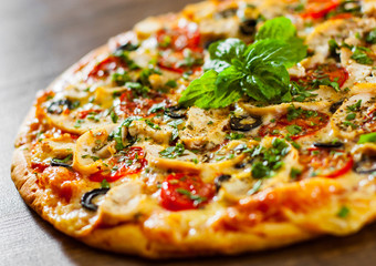 Pizza with Chicken meat, Mozzarella cheese, tomato, olive. Italian pizza on wooden background