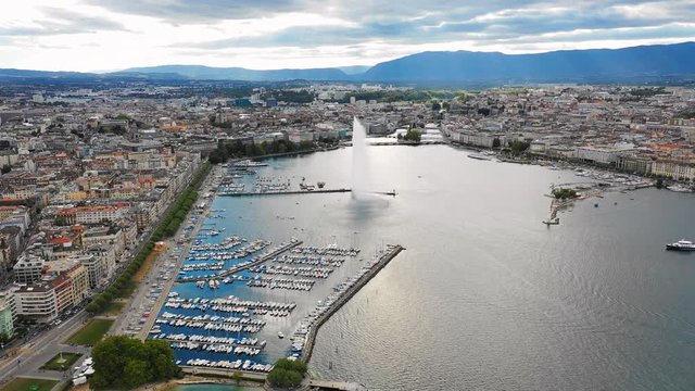 Aerial panoramic view of cityscape of Geneva, city by Lake Geneva (Lac Leman), famous fountain Jet d'Eau (Water Jet) - landscape panorama of Switzerland from above, Europe