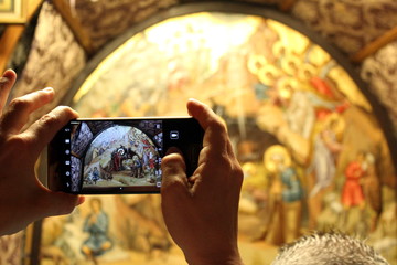 Taking a photo of the Grotto of the Nativity