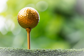 Golf golf ball and pins gold against the background of natural beauty, the ultimate victory of golf