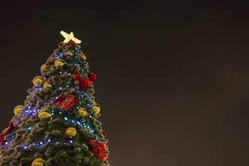 Beautiful new year background. Christmas tree with beautiful decorations. Christmas lights and beautiful spruce