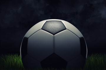 3d rendering of a single football ball standing on a grass field on a dark background.