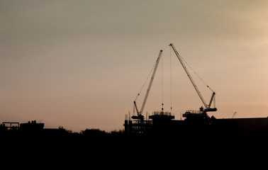 Fototapeta premium crane silhouette and sky sundown background