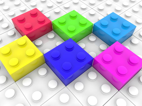 Six different color playing bricks on white brick background
