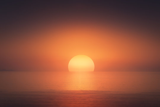 red sunset with big sun over the sea © mimadeo
