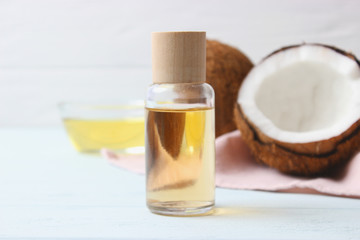 coconuts and coconut oil on a wooden background.