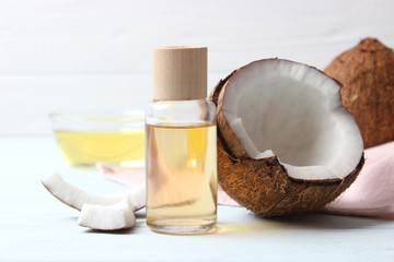 coconuts and coconut oil on a wooden background.