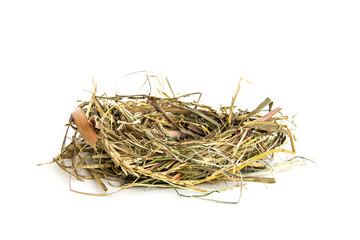 Bird's nest From grass dry and straw or natural material isolated on white background.