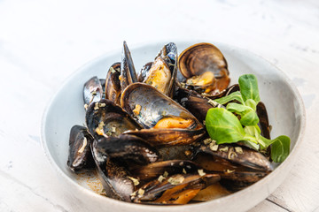 Mussel with white wine sauce on table