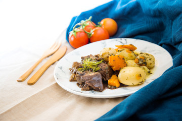 Beef meat stewed with potatoes-Traditional French cuisine Beef Bourguignon potatoes carrots in persillade