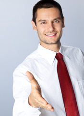 Businessman giving hand for handshake