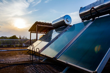 Solar panel, water heater on house roof, green energy