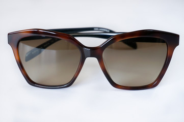 Brown unisex sunglasses on white background
