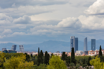Fototapeta na wymiar Skyline of Madrid with the four towers in the background and the cemetery of Almudena in the foreground