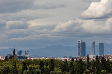 Fototapeta na wymiar Skyline of Madrid with the four towers in the background and the cemetery of Almudena in the foreground