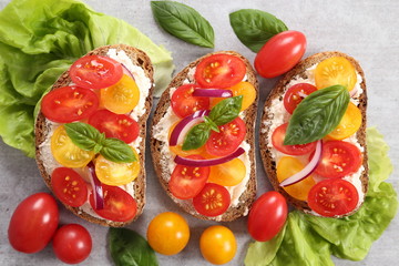 Sandwiches with cheese and tomatoes.